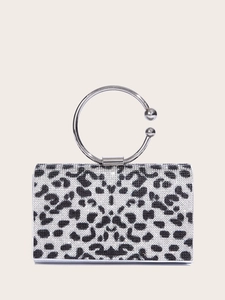 Detailed shot of sparkling leopard print evening bag with silver metal ring handle