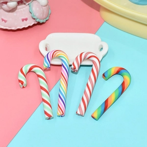 Macro detail of red-white and rainbow resin candy cane miniatures for DIY crafts