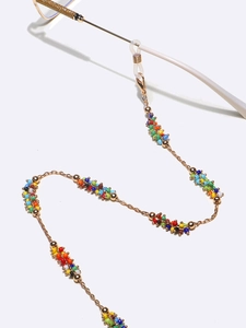 Detail of colorful beads and gold metal chain eyewear strap with anti-slip silicone loops