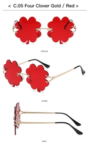 Three-view shots of gold-framed four leaf clover shaped sunglasses with red resin lenses