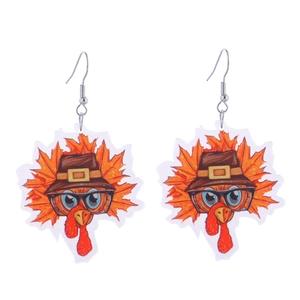 Detail view of acrylic Thanksgiving turkey earrings with festive orange and red accents