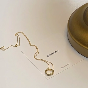 Elegant 925 sterling silver gold necklace with irregular circular pendant on card