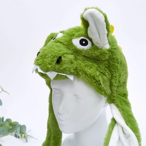 Detail of green plush dinosaur hat for kids with soft faux fur and ear protection