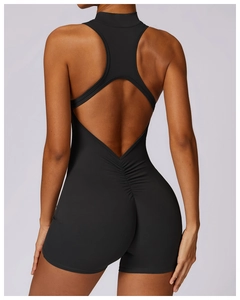 Detailed back view of a black ruched sports romper with high-stretch fabric and cutout design