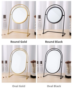 Detail of round and oval desktop makeup mirrors with minimalist gold and black iron frames