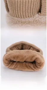 Detail of warm knitted camel winter neck warmer with soft faux rabbit fur lining