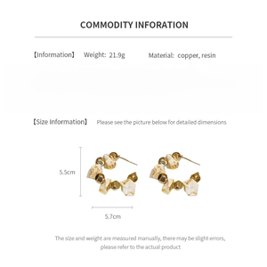 Detailed size information of large geometric resin earrings in gold and white tones