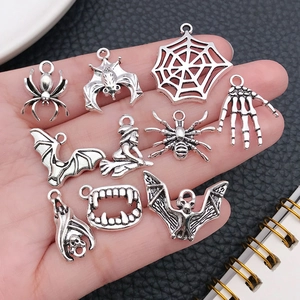 Set of silver alloy Halloween charms featuring spiders bats and witches for DIY jewelry