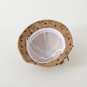 Detailed inner view of corduroy baby sun hat with bear print and elastic drawstring