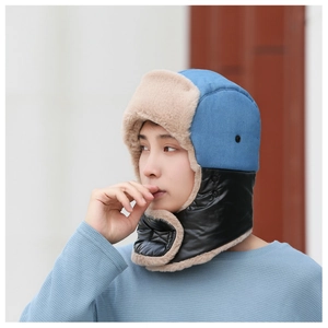 Close-up of winter trapper hat with faux fur lining and windproof neck protection cover