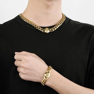 Polished gold-tone Cuban chain necklace and bracelet set with Medusa relief emblem clasp