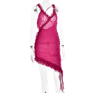 Detail of rose red mesh dress featuring ruffled edges and asymmetrical hemline design