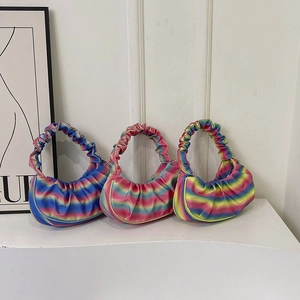 Three colorful rainbow pleated shoulder bags with a cloud-like texture and satin finish