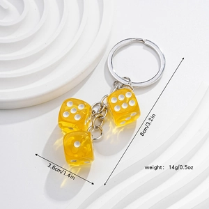 Detailed view of yellow transparent dice keychain showing 8cm length and 14g weight dimensions