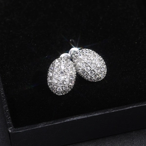 Fashionable oval hollow stud earrings with white cubic zirconia in a black gift box