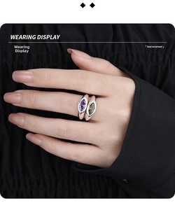 Wearing display of a double band ring featuring purple and amber marquise-cut stones