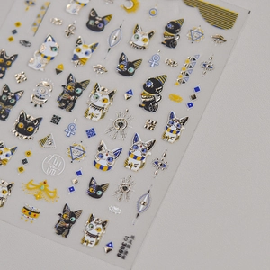 Detail of ancient Egyptian cat nail stickers with gold foil and eye of Horus patterns