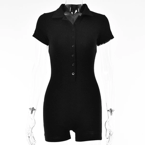 Detail of black short sleeve romper featuring a turn-down collar and button front closure