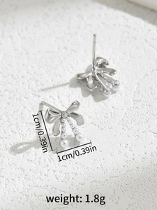 Detail of silver bow earrings with gradient pearls showing size and weight specs