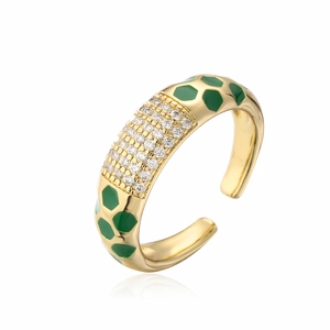 Detail of 18K gold-plated ring with green enamel spots and white cubic zirconia stones