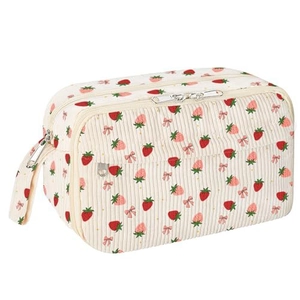 Macro view of strawberry corduroy pencil case with pink bows and portable side strap handle