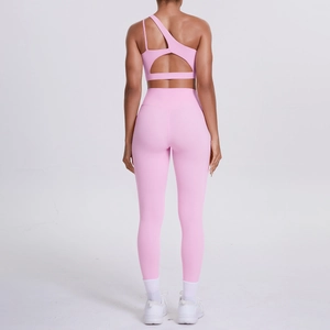 Rear view of pink one-shoulder sports bra and high-waisted yoga leggings set