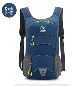 Detail of blue hiking backpack showing mesh side pockets and reflective safety triangle