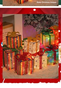 Close-up of three glowing Christmas gift boxes with bows on a snowy background