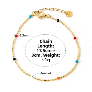 Detail of 2.3mm colorful enamel beads on a gold stainless steel chain bracelet