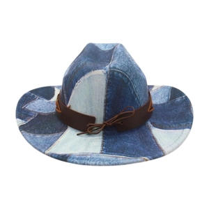 Detail of vintage denim patchwork cowboy hat with brown leather band and decorative bow