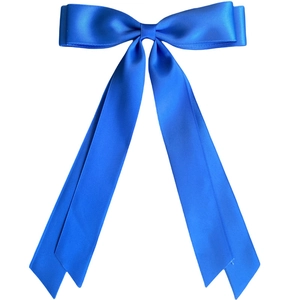 Close-up of a glossy blue ribbon bow hair clip with elegant silk hanging streamers