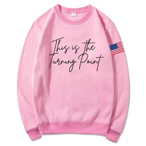 Pink unisex hoodie with Turning Point lettering and American flag patch on the sleeve