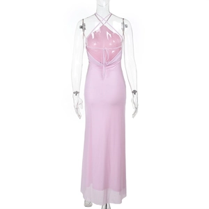 Detail of pink halter backless mesh maxi dress showing the tiered fabric and cross back strap