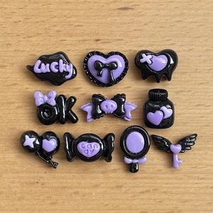 Dark purple resin DIY charms featuring hearts, wings and bows for hair clips and phone cases