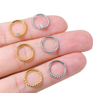 Set of gold and silver stainless steel septum rings with heart engraving and zircons