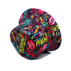 Detail of colorful pop art bucket hat with red lips graffiti and canvas texture