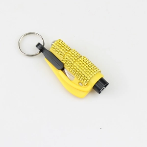 Detail of emergency window breaker and seatbelt cutter with sparkling yellow rhinestones