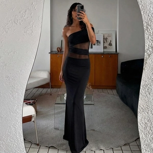Detail of slim fit black maxi dress featuring one-shoulder mesh cutout and sheer patchwork