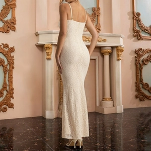 Close-up of ivory lace mermaid gown back showing intricate floral textures and fit