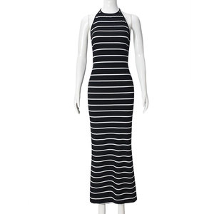Close-up of black and white striped knit texture and halter neck detail on the dress