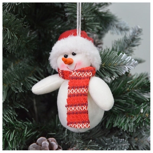 Close-up of a plush snowman ornament with red hat hanging on a Christmas tree branch