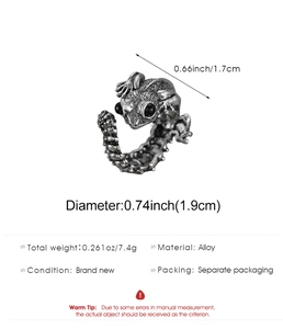 Detail view of gothic lizard ring with textured alloy finish and black beaded eyes