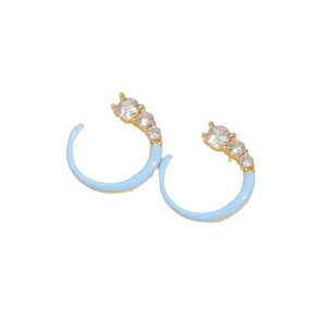 Gold C-shaped earrings with blue enamel and sparkling zircon stones for women