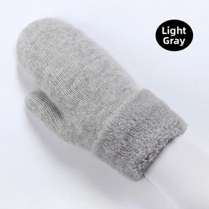 Detailed view of light grey thick knit mittens with plush white fleece cuffs for winter