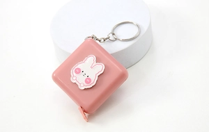 Pink square retractable tape measure with cute rabbit decor and metal keychain accessory
