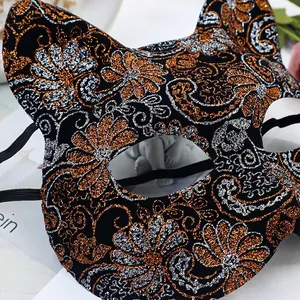 Cat face mask for cosplay with gold and silver glitter floral patterns on black base
