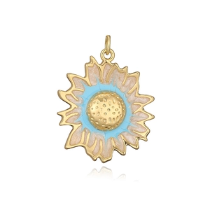 Macro detail of sunflower pendant with blue and champagne enamel and honeycomb texture