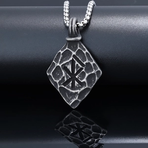 Vintage stainless steel Viking rune pendant necklace with antique silver finish on a stand