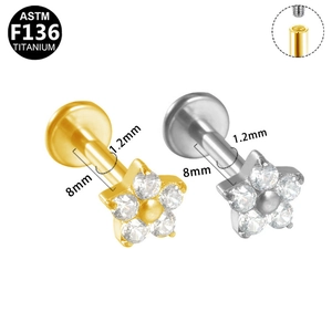 Detail view of G23 titanium flower labret studs with internal threading and zircon