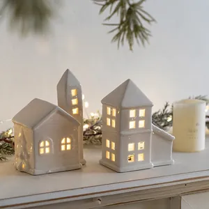 White ceramic Christmas house night lights set with warm LED glow and cut-out windows